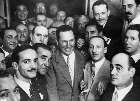 Orig. caption... PERON VICTORIOUS Buenos Aires, Argentina. Col. Juan Domingo Peron, surrounded by friends, receives the news of his victory over Dr. Jose Tamborini in the most hotly-contested election in Argentina in many years. Peron, often referred to as the strong man of the Argentine is now 50. As a military man he was distinguished as a champion fencer and the best swordsman in the army. He is married for the second time. His wife is the former actress and radio entertainer, Maria Eva Duarte. Note J Peron, 1895-1974, Argentine military and politician, president 1946-1955 and 1973-1974. Leader of the Peronist movement. CD 27.210.7 persons: JUAN PERON sites: SOUTH AMERICA; ARGENTINA sp_sw x5600x *** Orig caption PERON VICTORIOUS Buenos  Copyright: xXxXxXx PERON WINS THE 1946 ELECTION