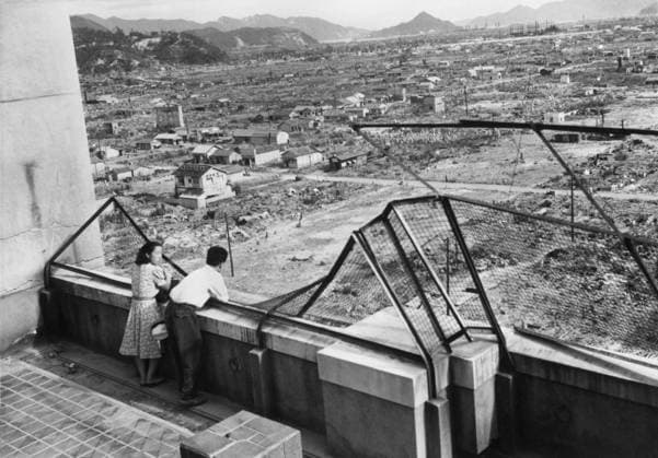 Orig. caption... VALLEY OF DEATH STRUGGLES BACK TO LIFE Hiroshima, Japan. These comparison photos, taken from the same spot and by the same photographer in atom-bombed Hiroshima, show the efforts made by Japanese citizens of the city to erase evidence that this city was once referred to as the valley of death. The photo on the left shows the city on August 6th, 1946, one year after the atomic bomb blast leveled it. The photo on the right shows the same view four years after the fateful blast. In the one-year-after view, tar-paper shacks and prefabricated wooden houses supplied by the government break up the completely flattened area. Note The atomic bomb After the war CD323 sites: HIROSHIMA; JAPAN sp_sw x5600x *** Orig caption VALLEY OF D  Copyright: xx ONE YEAR AFTER THE BOMB