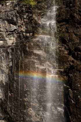 Creative Highlights World UNESCO World Heritage Site Geirangerfjord A rainbow appears through the mist of a waterfall cascading down the cliffs in Geiranger Fjord, Norway, on September 18, 2024. Geiranger Fjord, a major tourist attraction in Norway, was designated a UNESCO World Heritage Site in 2005. A growing fissure on one of its cliffs raises concerns about the possibility of a large rockslide, which could trigger a deadly tsunami, posing a significant threat to the region. Geiranger Norway  Copyright: xManuelxRomanox originalFilename: romano-unescowo240918_npIOk.jpg