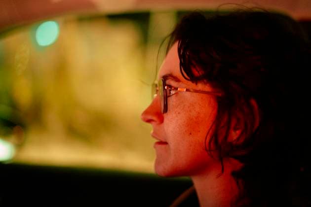 Creative Highlights Symbolfotos Side profile of a smiling young adult wearing glasses in a dimly lit car interior at night. Malaga Spain bola03289 Copyright: xConnectxImagesx ,model released
