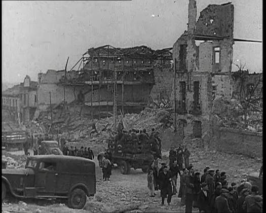 RECORD DATE NOT STATED Lorries Carrying Spanish Nationalist Soldiers Loyal To Franco Through Madrid Past the Remains of Destroyed Buildings as Spectators are Looking On, 1939. From Time To Remember - The Reluctant Warriors, 1939 (Reel 1); documentary about events of 1939 - preparations for war and then hostilities break out. Copyright:xBritishxPathexLtd HeritagexImagesxBritishxPathexLtdx IMAGO, ! ACHTUNG: AUFNAHMEDATUM GESCHÄTZT!  Copyright:BritishxPathexLtd HeritagexImagesxBritishxPathexLtdx IMAGO