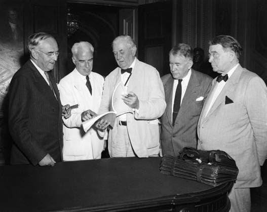Orig. caption... CHARTER CHAMPION Washington, D.C. Men who championed the United Nations charter which was ratified by the senate 89 to 2 on Saturday, are pictured looking over a copy of the history-making document. Left to right; Senator Arthur Vandenberg, of Michigan; former secretary of state Edward R. Stettinius, who was chairman of the United States delegation to the charter conference at San Francisco; Senator Tom Connally, of Texas; Senator Alben Barkley, of Kentucky, and Senator Kenneth McKeller, of Tennessee. Note The UN replaced the NF and the new statutes were signed in San Fransisco in 1945. The UN was constituted in January 1946. persons: Arthur Vandenberg ;Tom Connally ;Alben Barkley ;Kenneth Mc Keller ;Edward R Stettinius sit  Copyright: xXxXxXx UN DECLARATION 1945