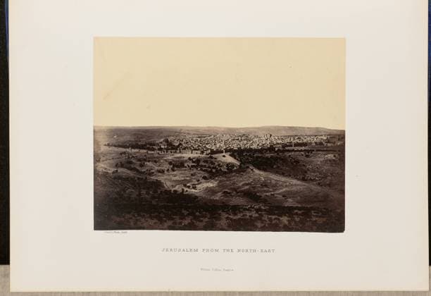 RECORD DATE NOT STATED Jerusalem from the North-East. John Cramb, photographer (Scottish, active 1850s - 1860s) 1860 Elevated view of Jerusalem from a distance. The Dome of the Rock is visible on the left side of the image near the edge of the Old City, where the city wall separates it from the Kidron Valley. (Recto, mount) lower left, below print, letterpress in black ink: Cramb, Photo. 1860. Lower center, letterpress in black ink: JERUSALEM FROM THE NORTH-EAST. William Collins, Glasgow. (Verso, mount) lower left, handwritten in pencil: IB 51.11 (CRA) Copyright: xpiemagsx piemagsrmnb13020224-3559 !ACHTUNG AUFNAHMEDATUM GESCHÄTZT!