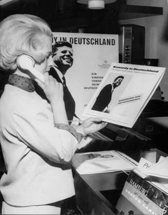Orig. caption... KENNEDY IN DEUTSCHLAND das ist der Titel einer Schallplatte, die ab heute auf dem Markt bezälllich ist. Die Platte enthält Reden des amerikanischen Präsidenten während seines Deutschlandsbesuches in Bonn, Köln, Frankfurt und Berlin. Die Platte costs DM 12,-- Note. CD 172 LPs Speech Listen Headphone persons: JOHN F KENNEDY* sites: GERMANY sp_sw x5600x *** Orig caption KENNEDY IN GERMANY this is the title of a record which is on sale from today The record contains speeches of the American President during his visit to Germany in Bonn, Cologne, Frankfurt and Berlin The record costs DM 12, Note CD 172 LPs Speech Listen Headphone persons JOHN F KENNEDY sites GERMANY sp sw x5600x  Copyright: xx KENNEDY ON GRAMOPHONE RECORD