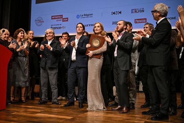 16th Lumiere Film Festival Lumiere Award Ceremony Isabelle Huppert, Ronald Chammah and their sons Angelo and Lorenzo attending the Lumiere Award Ceremony ( Prix Lumiere ) during the 16th Lumiere Film Festival in Lyon, France on October 18, 2024. Photo by Julien Reynaud APS-Medias ABACAPRESS.COM Lyon France  Copyright: xReynaudxJulien APS-Medias ABACAx