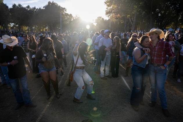 October 18, 2024, Sacramento, Ca, USA: Darean Wilder and Bailey Coughman dance to Shane Smith & The Saints during the Golden Sky Music Festival at Discovery Park on Friday, Oct. 18, 2024 in Sacramento. Sacramento USA - ZUMAj89_ 20241018_zaf_j89_003 Copyright: xPaulxKitagakixJr.x