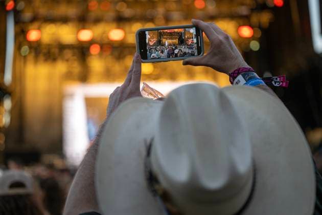 October 18, 2024, Sacramento, Ca, USA: Fans takes video of Clint Black performance during the Golden Sky Music Festival at Discovery Park on Friday, Oct. 18, 2024 in Sacramento. Sacramento USA - ZUMAj89_ 20241018_zaf_j89_018 Copyright: xPaulxKitagakixJr.x