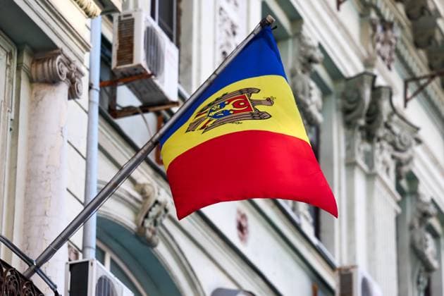 RUSSIA, MOSCOW - OCTOBER 20, 2024: The Moldovan national flag is seen on the building of the Moldovan Embassy in Moscow as people vote in the 2024 Moldovan presidential election and in the referendum on Moldovaâ€™s joining the EU. Sofya Sandurskaya TASS  75182042