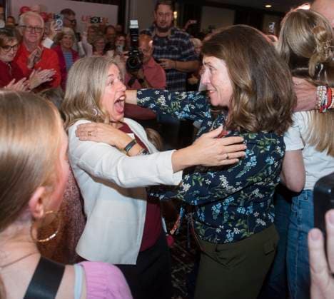 October 21, 2024, Fredericton, Nb, Canada: Fredericton Mayor Kate Rogers embraces New Brunswick Liberal Leader and premier-elect Susan Holt, left, following her election win in Fredericton, Monday, Oct. 21, 2024. Fredericton Canada  - ZUMAc35_ 20241021_zaf_c35_117 Copyright: xStephenxMacgillivrayx