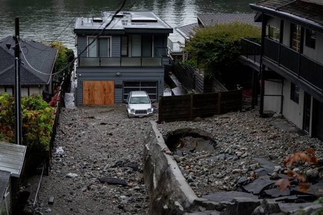 October 22, 2024, North Vancouver, Bc, CANADA: Multiple homes are seen surrounded by debris left by flooding from torrential rain from an atmospheric river weather system at Deep Cove in North Vancouver, on Tuesday, October 22, 2024. North Vancouver CANADA  - ZUMAc35_ 20241022_zaf_c35_125 Copyright: xEthanxCairnsx