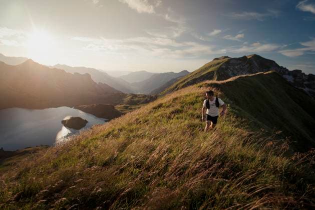 Man running on mountains of Allgau Alps at sunset in Bavaria, Germany model released, Symbolfoto, MALF00452