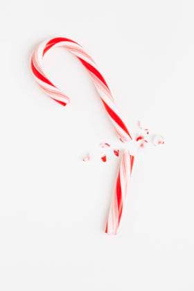 Red and white broken candy cane, studio shot , 03.10.2012, TTBB_ti2400129.jpg, Christmas, Candy Cane, Red, White, Broken, Copy Space, Still Life, Single Object, Food And Drink, Sweet Food, Striped, Vertical, Close-Up, Backgrounds, Elevated View, Part Of, Focus On Foreground, Unhealthy Eating, No People, Studio Shot, White Background, Full Length Copyright: xSarahxM.xGolonkax