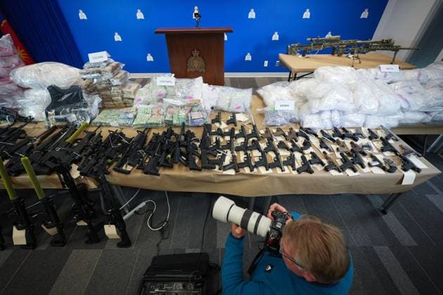 October 31, 2024, Surrey, Bc, CANADA: Firearms and illicit drugs seized last week are displayed before a news conference at RCMP headquarters, in Surrey, B.C., on Thursday, October 31, 2024. The RCMP says they have dismantled the largest and most sophisticated fentanyl and methamphetamine drug superlab in Canada, after an operation was conducted in Falkland, B.C., and Surrey beginning last Friday. Surrey CANADA - ZUMAc35_ 20241031_zaf_c35_076 Copyright: xDarrylxDyckx