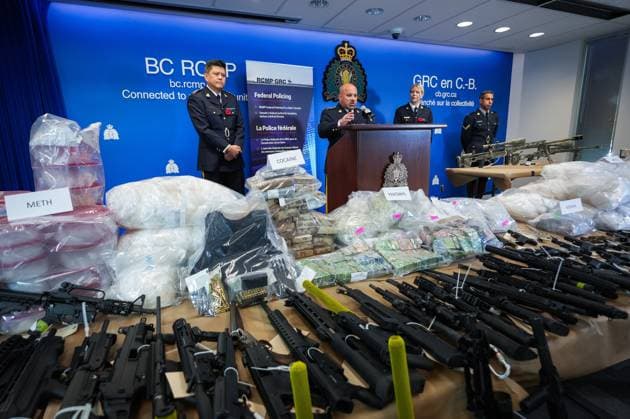 October 31, 2024, Surrey, Bc, CANADA: Firearms and illicit drugs seized last week are displayed as RCMP Chief Supt. Stephen Lee, left to right, Asst. Commissioner David Teboul, Insp. Jillian Wellard and Cpl. Arash Seyed attend a news conference at RCMP headquarters, in Surrey, B.C., on Thursday, October 31, 2024. The RCMP says they have dismantled the largest and most sophisticated fentanyl and methamphetamine drug superlab in Canada, after an operation was conducted in Falkland, B.C., and Surrey beginning last Friday. Surrey CANADA - ZUMAc35_ 20241031_zaf_c35_095 Copyright: xDarrylxDyckx