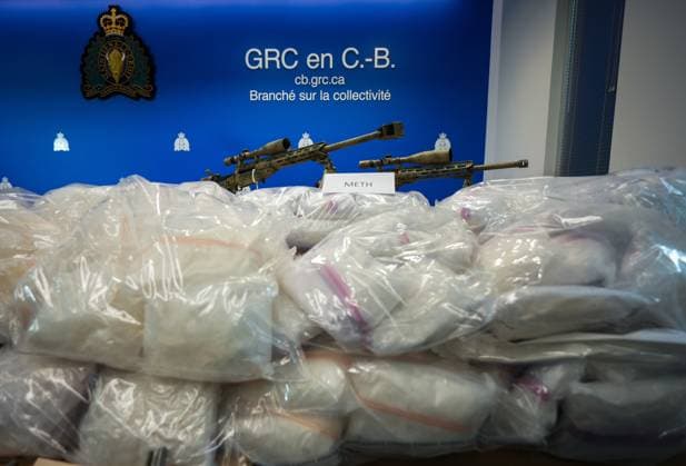 October 31, 2024, Surrey, Bc, CANADA: Methamphetamine and firearms, including a .50-calibre machine gun, that were seized last week, are displayed before a news conference at RCMP headquarters, in Surrey, B.C., on Thursday, October 31, 2024. The RCMP says they have dismantled the largest and most sophisticated fentanyl and methamphetamine drug superlab in Canada, after an operation was conducted in Falkland, B.C., and Surrey beginning last Friday. Surrey CANADA - ZUMAc35_ 20241031_zaf_c35_101 Copyright: xDarrylxDyckx