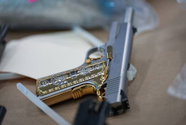 October 31, 2024, Surrey, Bc, CANADA: A Ruger handgun that was seized last week is displayed before a news conference at RCMP headquarters, in Surrey, B.C., on Thursday, October 31, 2024. The RCMP says they have dismantled the largest and most sophisticated fentanyl and methamphetamine drug superlab in Canada, after an operation was conducted in Falkland, B.C., and Surrey beginning last Friday. Surrey CANADA - ZUMAc35_ 20241031_zaf_c35_102 Copyright: xDarrylxDyckx