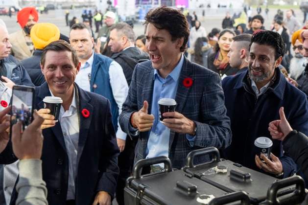 November 1, 2024, Brampton, On, CANADA: Mayor Patrick Brown, left, Prime Minister Justin Trudeau, middle, and Liberal Member of Parliament for Brampton East Maninder Sidhu react after taking a sip of chai from Chaiiwala of London at the Diwali Mela festival at Sesquicentennial Park in Brampton, Ont., Friday, Nov. 1, 2024. Brampton CANADA  - ZUMAc35_ 20241101_zaf_c35_068 Copyright: xAndrewxLahodynskyjx