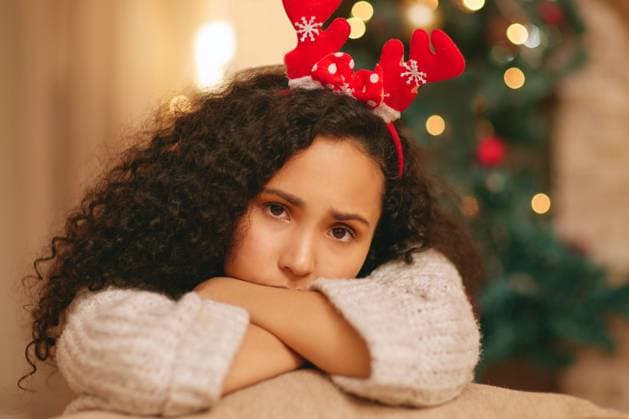 Portrait, sad woman and depression on Christmas in home with anxiety, worry and emotional crisis. Face of lonely female person feeling unhappy, bored and disappointed in festive holiday with headband. model released property released Copyright: xYURIxARCURSxPRODUCTIONSx