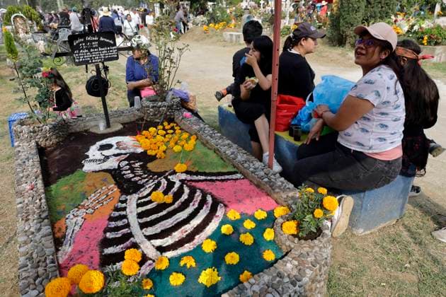 Day Of The Dead In Mexico People attend the Tecomitl community pantheon in Mexico City, Mexico, on November 2, 2024, and decorate the graves of their deceased loved ones with cempasuchil flowers and figures made from mud. According to belief, these will receive their souls during the Day of the Dead festivities on November 2. Mexico City Mexico  Copyright: xGerardoxVieyrax originalFilename: vieyra-notitle241102_np0Kw.jpg
