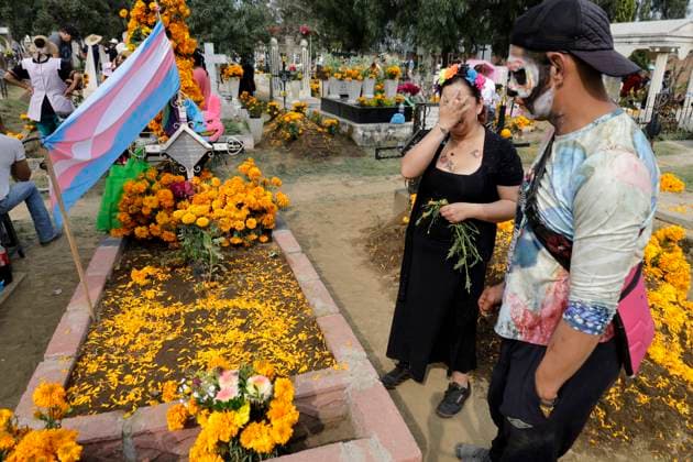 Day Of The Dead In Mexico A view of a trans flag at the Tecomitl community cemetery in Mexico City, Mexico, on November 2, 2024, shows dozens of people decorating the graves of their deceased loved ones with cempasuchil flowers and figures made from mud. According to belief, these decorations will receive their souls tonight during the Day of the Dead festivities on November 2 in Mexico. Mexico City Mexico  Copyright: xGerardoxVieyrax originalFilename: vieyra-notitle241102_npX3j.jpg