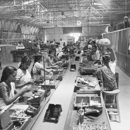 Workers at the assembly line ; telephone factory ; manufacturing of telephone instruments at Bangalore ; Karnataka Copyright: xTxSatyan DinodiaxPhotox