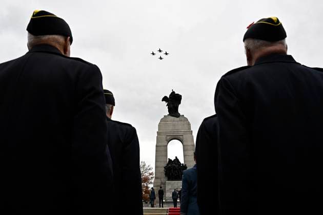 November 11, 2024, Ottawa, On, CAN: Veterans look on as Canadian CF-18 fighter jets perform a fly past at a Remembrance Day ceremony at the National War Memorial in Ottawa on Monday, Nov. 11, 2024. Ottawa CAN  - ZUMAc35_ 20241111_zaf_c35_020 Copyright: xJustinxTangx