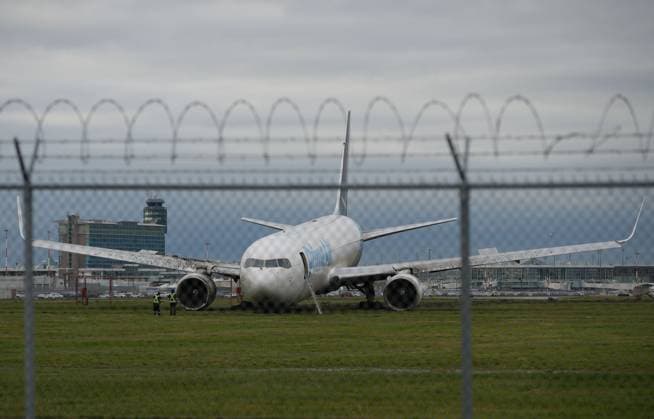 (241119) -- RICHMOND (CANADA), Nov. 19, 2024 -- A cargo jet is seen after going off the runway at Vancouver International Airport in Richmond, British Columbia, Canada, on Nov. 19, 2024. The cargo jet went off the runway at Vancouver International Airport Tuesday morning. Fire and rescue attended the scene, and there were no injuries reported and the crew of three were safely deplaned, the airport said. (Photo by Xinhua) CANADA-RICHMOND-VANCOUVER INTERNATIONAL AIRPORT-CARGO JET-RUNWAY-GOING OFF LiangxSen 