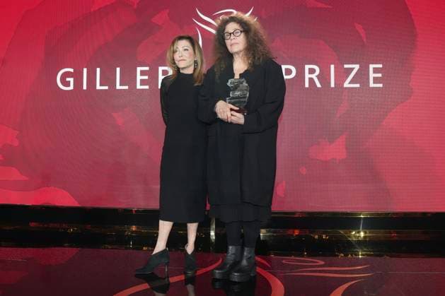 November 18, 2024, Toronto, Ontario, Canada: ANNE MICHAELS, 66, (right) stands with ELANA RABINOVITCH, the Executive Director of Giller Prize accepting the Giller Prize of $100,000 for her book Held a multigenerational look at war and trauma spanning more than a century. The jury cited the novel as an impactful and hypnotic exploration of mortality, resilience and desires, at ceremony in Toronto, Monday. Award boycotted by several prominent Canadian authors over its sponsors’ ties to Israel. Based in Toronto, Michaels a poet and author. In her acceptance speech, said that her writing is a way of bearing witness against war, indifference, against amnesia of every sort. Toronto Canada - ZUMAc35_ 20241118_zaf_c35_173 Copyright: xChrisxYoungx