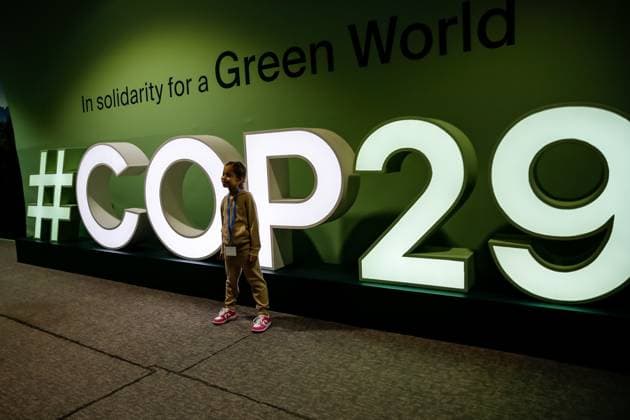 News Themen der Woche KW47 News Bilder des Tages UN Climate Conference COP29 in Baku - Day ten - 21 Nov 2024 A girl poses in front of COP29 logo in Blue Zone during the United Nations Climate Change Conference COP29, an event held by United Nations Framework Convention on Climate Change (UNFCCC) at Baku Olympic Stadium. COP29, running from November 11-22 focuses on carbon offset clean energy funding. Baku Azerbaijan Copyright: xDominikaxZarzyckax xSOPAxImagesx November_21_2024_Baku_COP29_day10-19