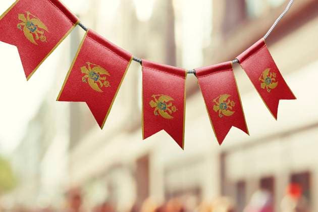 A garland of Montenegro national flags on an abstract blurred background A garland of Montenegro national flags on an abstract blurred background. Copyright: xZoonar.com BUTENKOVxALEKSEYx 20190426