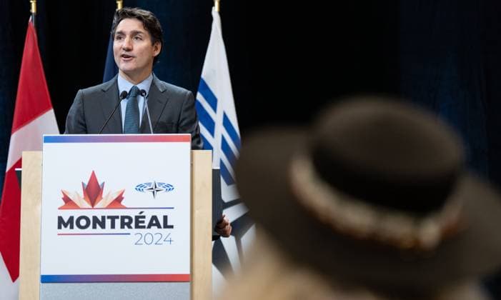 November 25, 2024, Montreal, Pq, CANADA: Prime Minister Justin Trudeau delivers remarks as Elder Gail Golder looks on at the 70th Annual Session of the NATO Parliamentary Assembly in Montreal on Sunday, Aug.11, 2024. Montreal CANADA  - ZUMAc35_ 20241125_zaf_c35_015 Copyright: xChristinnexMuschix
