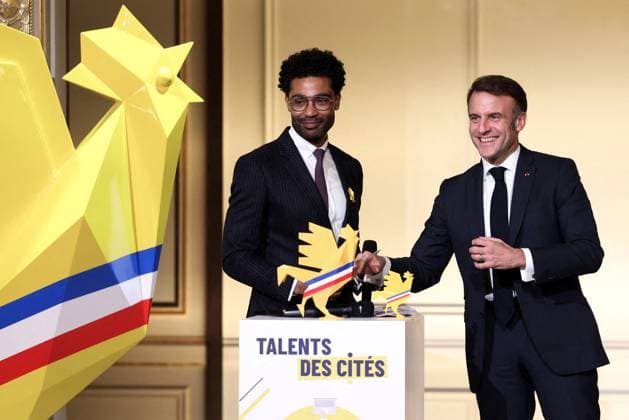 Macron Presides Over Young Talented Entrepreneur Award Ceremony - Paris President Emmanuel Macron stands on stage with an award winner during the award ceremony for young talented entrepreneurs from immigration suburbs in France at the Elysee Palace in Paris, France on November 27, 2024. Photo by Stephane Lemouton Pool ABACAPRESS.COM Paris France  Copyright: xLemoutonxStephane Pool ABACAx