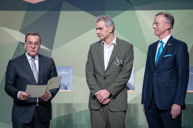 Presentation of the Bundeswehr and Society Award Boris Pistorius Federal Minister of Defense presents the award to Oliver Sluka Headmaster of Vocational School 7 with Dr. Gerd Landsberg Honorary Director of the German Association of Towns and Municipalities at the presentation of the Bundeswehr and Society Award in the Paul Loebe Haus in Berlin Berlin Berlin Ger