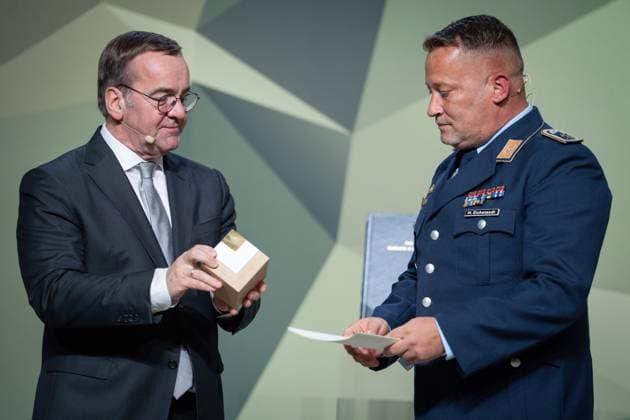 Presentation of the Bundeswehr and Society Award Boris Pistorius Federal Minister of Defense presents the Bundeswehr Award to Staff Sergeant Michael Eichstaedt, Forest of Remembrance at the presentation of the Bundeswehr and Society Award in the Paul Loebe Haus in Berlin Berlin Berlin Germany