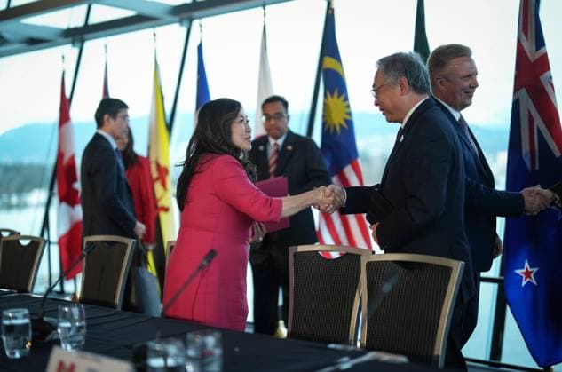 November 28, 2024, Vancouver, Bc, CANADA: Canada s Minister of Export Promotion, International Trade and Economic Development Mary Ng, left, shakes hands with Singapore Deputy Prime Minister and Minister for Trade and Industry Gan Kim Yong after the closing news conference at the Comprehensive and Progressive Agreement for Trans-Pacific Partnership (CPTPP) commission meeting, in Vancouver, on Thursday, November 28, 2024. Vancouver CANADA - ZUMAc35_ 20241128_zaf_c35_099 Copyright: xDarrylxDyckx