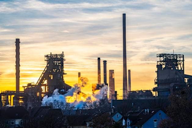 Blast furnace Schwelgern 1 and 2, ThyssenKrupp Steel plant Schwelgern in Duisburg Marxloh belongs to the steelworks Bruckhausen, sunset, NRW, Germany Thyssenkrupp Steel blast furnaces