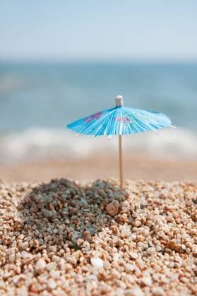 Shade at the beach Blue Chinese paper parasol for shade at the sunny beach Copyright: xZoonar.com IvonnexWierinkx 7381113