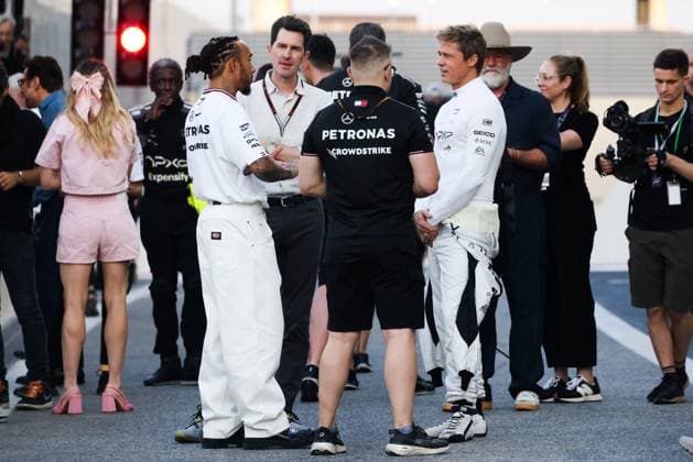 December 5, 2024, Abu Dhabi, United Arab Emirates: Brad Pitt, actor playing Sonny Hayes, a driver of the fictional Apex APXGP F1 team in the upcoming F1 movie directed by Joseph Kosinski, and Lewis Hamilton of Mercedes are seen on a movie set ahead of Formula 1 Abu Dhabi Grand Prix at Yas Marina Circuit on December 5th, 2024 in Abu Dhabi, United Arab Emirates. Abu Dhabi United Arab Emirates - ZUMAz156 20241205_zip_z156_037 Copyright: xBeataxZawrzelx