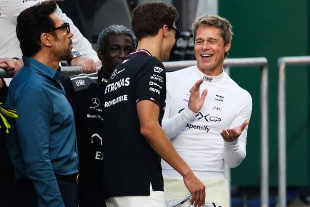 December 5, 2024, Abu Dhabi, United Arab Emirates: Brad Pitt, actor playing Sonny Hayes, a driver of the fictional Apex APXGP F1 team in the upcoming F1 movie directed by Joseph Kosinski, and George Russell of Mercedes are seen on a movie set ahead of Formula 1 Abu Dhabi Grand Prix at Yas Marina Circuit on December 5th, 2024 in Abu Dhabi, United Arab Emirates. Abu Dhabi United Arab Emirates - ZUMAz156 20241205_zip_z156_040 Copyright: xBeataxZawrzelx