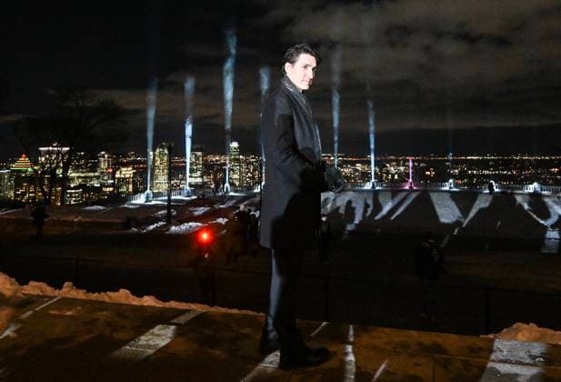 News BIlder des Tages December 6, 2024, Montreal, Pq, Canada: Prime Minister Justin Trudeau stands next to beams of light projected into the sky following a ceremony to honour the victims of the 1989 Polytechnique massacre in Montreal, Friday, December 6, 2024. Today marks the 35th anniversary of the shooting rampage that left 14 women dead. Montreal Canada  - ZUMAc35_ 20241206_zaf_c35_082 Copyright: xGrahamxHughesx