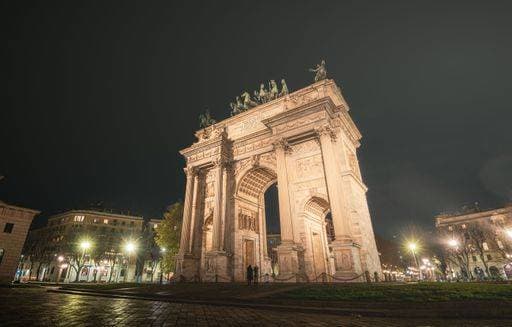 Night view of Arco della Pace in Milan, Italy, with illuminated streets and buildings in the background. 25922968 RECORD DATE NOT STATED