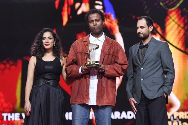 Marrakech Closing Ceremony Nadia Kounda, Director Mo Harawe receives the award for The village next to Paradise and Ali Abbasi during the Closing Ceremony during the 21st Marrakech International Film Festival in Marrakech, Morocco on December 07, 2024. Photo by Aurore Marechal ABACAPRESS.COM Marrakech Morocco  Copyright: xMarechalxAurore ABACAx