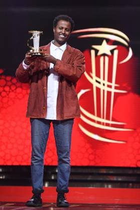 Marrakech Closing Ceremony Director Mo Harawe receives the award for The village next to Paradise attending the Closing Ceremony during the 21st Marrakech International Film Festival in Marrakech, Morocco on December 07, 2024. Photo by Aurore Marechal ABACAPRESS.COM Marrakech Morocco  Copyright: xMarechalxAurore ABACAx