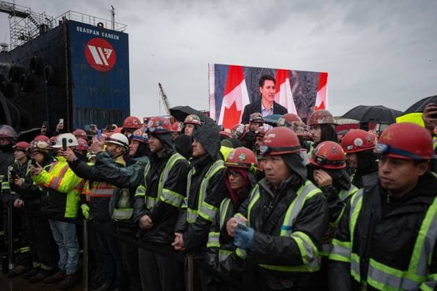 December 13, 2024, North Vancouver, Bc, CANADA: Prime Minister Justin Trudeau is seen on a video screen while speaking as workers listen during a launch and naming ceremony for the new Royal Canadian Navy Joint Support vessel HMCS Protecteur, at Seaspan Shipyards in North Vancouver, B.C., on Friday, December 13, 2024. The ship is scheduled to be delivered to the Royal Canadian Navy in 2025. North Vancouver CANADA  - ZUMAc35_ 20241213_zaf_c35_092 Copyright: xDarrylxDyckx