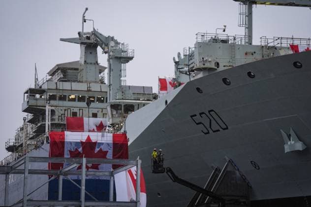 December 13, 2024, North Vancouver, Bc, CANADA: Workers are seen on a lift beside the new Royal Canadian Navy Joint Support vessel before a launch and naming ceremony at Seaspan Shipyards, in North Vancouver, B.C., on Friday, December 13, 2024. The ship is scheduled to be delivered to the Royal Canadian Navy in 2025. North Vancouver CANADA  - ZUMAc35_ 20241213_zaf_c35_095 Copyright: xDarrylxDyckx