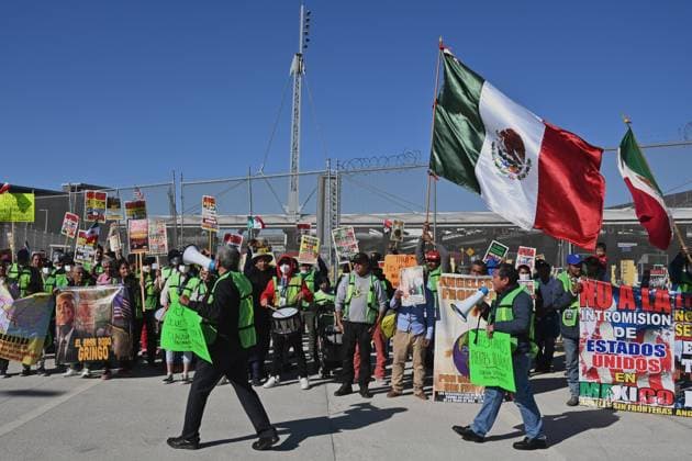 December 18, 2024, Tijuana, Baja California, Mexico: Mexican migrants who have been deported from the United States to Mexico, families seeking asylum and activists demonstrate on the need for migrants rights, the arrival of President-elect Donald Trump as U.S. president and no to mass deportation policies during a march and protest to the San Ysidro Port of Entry International U.S.-Mexico border during International Migrants Day in Tijuana, Mexico on Wednesday, December 18, 2024. Tijuana Mexico - ZUMAm180 20241218_zip_m180_001 Copyright: xCarlosxA.xMorenox