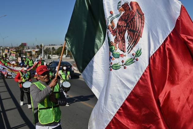 December 18, 2024, Tijuana, Baja California, Mexico: Mexican migrants who have been deported from the United States to Mexico, families seeking asylum and activists demonstrate on the need for migrants rights, the arrival of President-elect Donald Trump as U.S. president and no to mass deportation policies during a march and protest to the San Ysidro Port of Entry International U.S.-Mexico border during International Migrants Day in Tijuana, Mexico on Wednesday, December 18, 2024. Tijuana Mexico - ZUMAm180 20241218_zip_m180_008 Copyright: xCarlosxA.xMorenox
