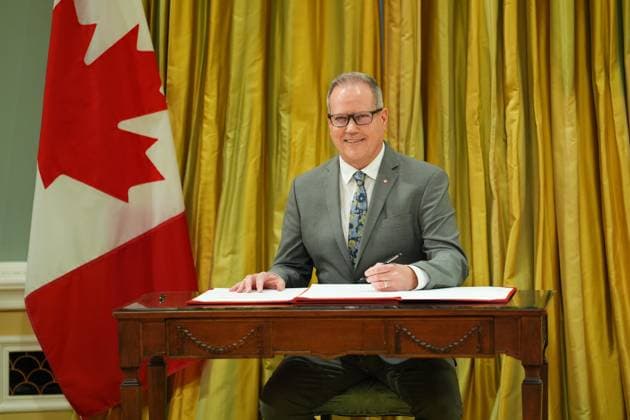 December 20, 2024, Ottawa, On, Canada: Veterans Affairs Minister Darren Fisher signs a document during a cabinet swearing-in ceremony at Rideau Hall in Ottawa, on Friday, Dec.20, 2024. Ottawa Canada  - ZUMAc35_ 20241220_zaf_c35_047 Copyright: xSeanxKilpatrickx