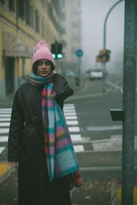 A woman in a pink hat and scarf stands on a foggy street A woman in a pink hat and scarf stands on a foggy street ,model released, Symbolfoto Copyright: xZoonar.com OleksiixHrecheniukx 22546475 ,model released, Symbolfoto ,property released