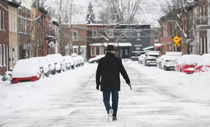 December 24, 2024, Montreal, Pq, Canada: A man walks along a snow-covered street following a snowstorm in Montreal, Tuesday, December 24, 2024. Montreal Canada  - ZUMAc35_ 20241224_zaf_c35_006 Copyright: xGrahamxHughesx